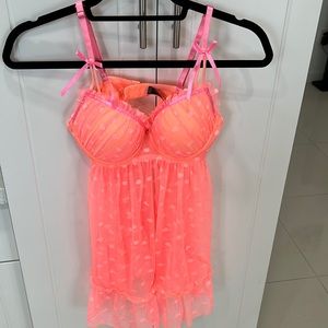 Woman’s intimate pajama, Size M, 90% nylon, 10% spandex, light pink, orange hue